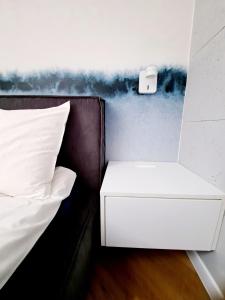 Posteľ alebo postele v izbe v ubytovaní Apartament Północne Mazury
