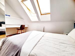 Posteľ alebo postele v izbe v ubytovaní Apartament Północne Mazury