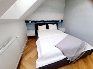 Posteľ alebo postele v izbe v ubytovaní Apartament Północne Mazury