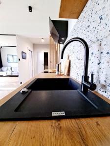 Kuchyňa alebo kuchynka v ubytovaní Apartament Północne Mazury