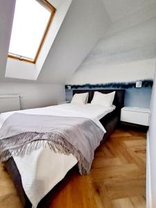 Posteľ alebo postele v izbe v ubytovaní Apartament Północne Mazury