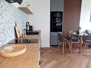 Kuchyňa alebo kuchynka v ubytovaní Apartament Północne Mazury