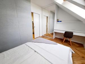 Posteľ alebo postele v izbe v ubytovaní Apartament Północne Mazury
