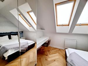 Posteľ alebo postele v izbe v ubytovaní Apartament Północne Mazury