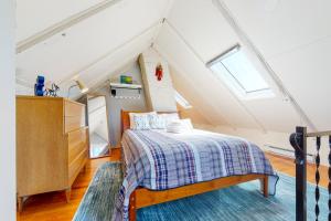 a bedroom with a bed in a attic at Monument View in Provincetown