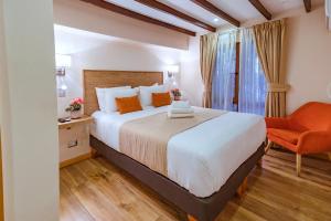 Postel nebo postele na pokoji v ubytování Tagle Hotel Boutique