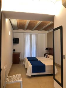 Postel nebo postele na pokoji v ubytování HOTEL ISLA PLANA