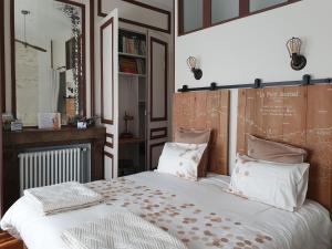 Кровать или кровати в номере B & B Les Secrets des Loges