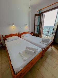 Posteľ alebo postele v izbe v ubytovaní Pansion Giannis Perris