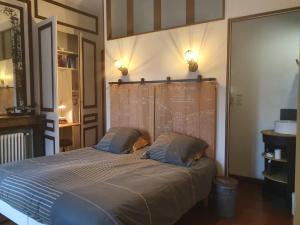Кровать или кровати в номере B & B Les Secrets des Loges