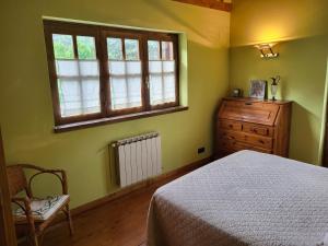 Un pat sau paturi într-o cameră la Casa de fusta al cor dels Pirineus