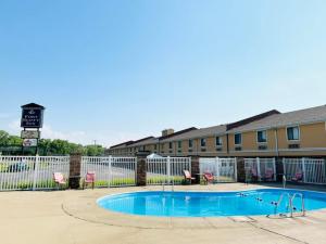a swimming pool at comfort inn suites anaheim at Super 8 by Wyndham Fort Scott in Fort Scott