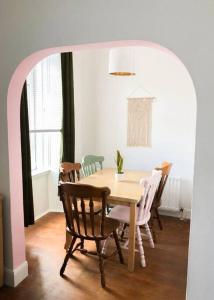 a dining room with a table and chairs at Light & Spacious Loch Lomond Apartment in Alexandria