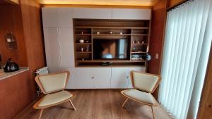 Posezení v ubytování Departamento muy cálido y luminoso, 2 ambientes con amplio balcón, 3PAX (8V4)