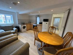 a kitchen and living room with a table and chairs at Entire Two Bedrooms Flat, 1F in Great Yarmouth