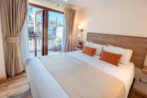 Postel nebo postele na pokoji v ubytování Tagle Hotel Boutique