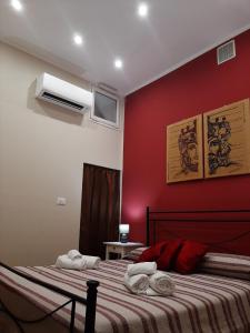 Posteľ alebo postele v izbe v ubytovaní CASA VACANZA DI VIA GIACALONE + 16 fotografií