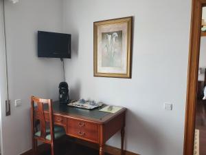 TV a/nebo společenská místnost v ubytování Posada La Merced