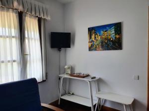 TV a/nebo společenská místnost v ubytování Posada La Merced + 22 fotografií