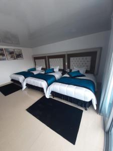 Ένα ή περισσότερα κρεβάτια σε δωμάτιο στο Hotel San Antonio Guarne
