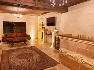 a living room with a couch and a table at Virtus Cappadocia Hotel Göreme in Göreme