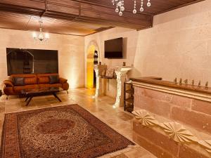 TV a/nebo společenská místnost v ubytování Virtus Cappadocia Hotel Göreme