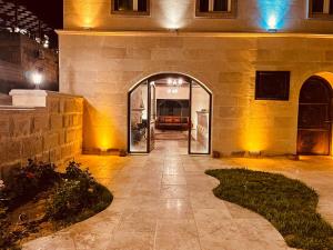 an entrance to a building with an archway at Virtus Cappadocia Hotel Göreme in Goreme
