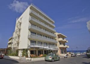 a building with a car parked in front of it at Nafsika Hotel in Rhodes Town