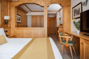 Posteľ alebo postele v izbe v ubytovaní Hotel Cristallo