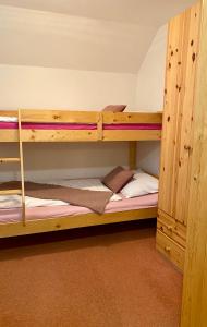 Postel nebo postele na pokoji v ubytování Alba Apartmany Železná Ruda