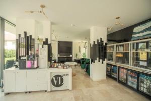 a large room with a store with a v sign on it at Vila Ducu Mamaia Nord - Teens and Adults Only 14 and Over in Mamaia Sat/Năvodari