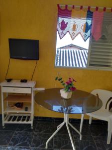 TV i/ili multimedijalni sistem u objektu Casa de praia em Itanhaem