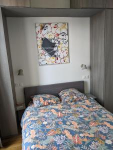 Postel nebo postele na pokoji v ubytování Trocadéro- 2 pièces lumineux