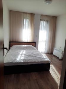 Ένα ή περισσότερα κρεβάτια σε δωμάτιο στο Апартамент Popoff