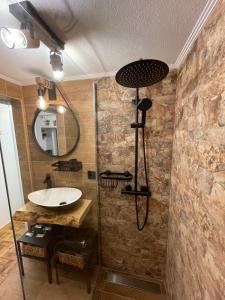 a bathroom with a sink and a shower at Apartamento Grace in Sintra +67 photos