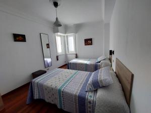 Posteľ alebo postele v izbe v ubytovaní Casa céntrica. A Coruña a 200m de la playa Riazor