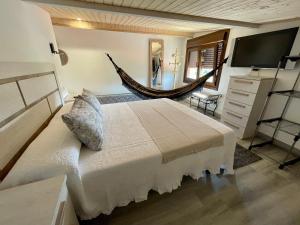 מיטה או מיטות בחדר ב-LAR DE SUSA