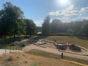 a playground in a park with people playing in it at Apartment 11 in Burg bei Magdeburg +3 photos