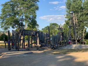 a playground in a park with a wooden play structure at Apartment 11 in Burg bei Magdeburg