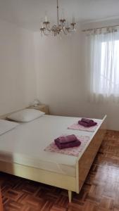 Postel nebo postele na pokoji v ubytování Apartman Milka
