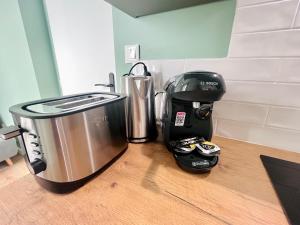 Η κουζίνα ή μικρή κουζίνα στο LE QUAI 2 - Studio neuf CALME TERRASSE - CLIM - WiFi - Gare à 200m