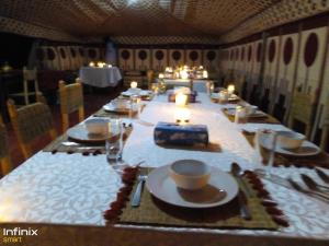 A restaurant or other place to eat at Zagora luxury desert camp