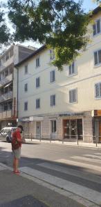 a person standing on the side of a street at Apartments Felicitas in Split