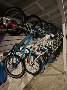a bunch of bikes lined up in a rack at Nad Rozlewiskiem in Bobolin