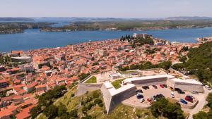 an aerial view of a city and a body of water at Memory Box Apartman - Šibenik in Šibenik