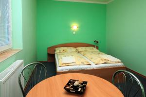 Posteľ alebo postele v izbe v ubytovaní ASCONA