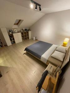 a bedroom with a bed and a table in it at A2 in Veliko Gradište