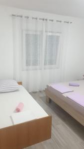 Postel nebo postele na pokoji v ubytování Apartman Dany
