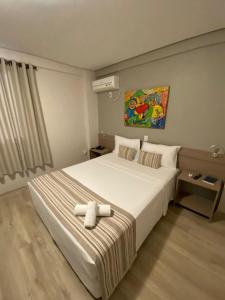 Posteľ alebo postele v izbe v ubytovaní Benos Hotel