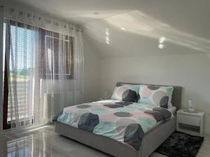 Postel nebo postele na pokoji v ubytování Apartman Pavenka